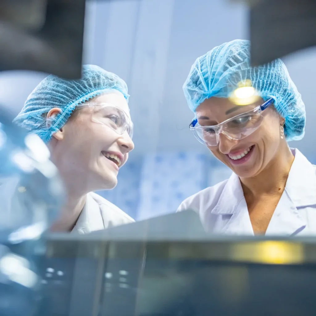 Biologics manufacturing staff in protective gear